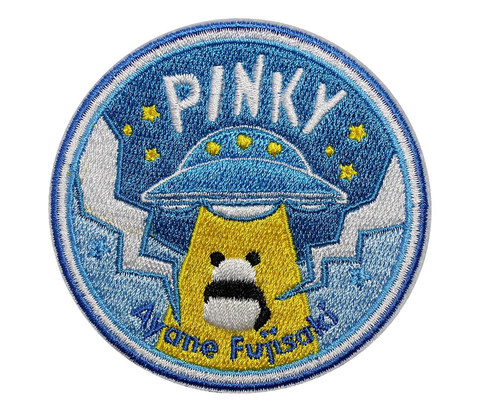 Stitch/Stitched with threads on a fabric backing, often with a raised, textured look.